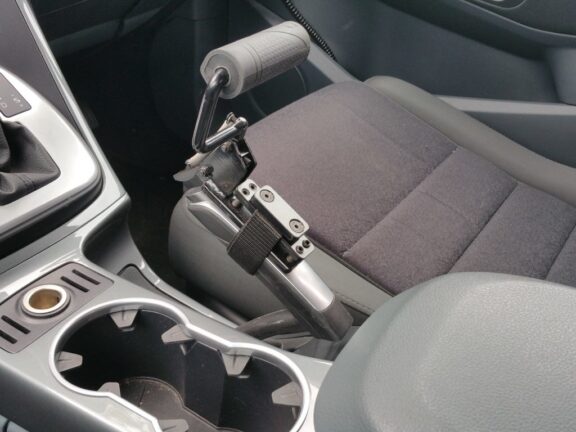 Easy release handle is attached to a standard handbrake lever.