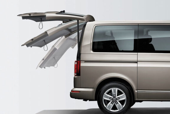 Automatic boot door shown in several positions from a side view.