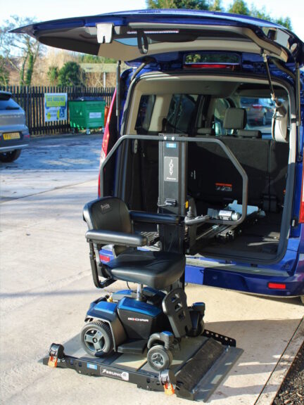 Joey Lift installed in a van with a scooter loaded in the lowest position.