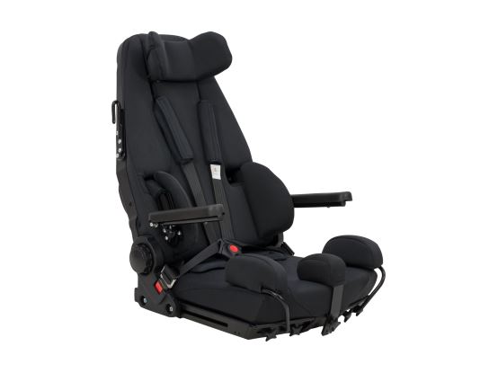 The GS Seat is a fabric covered car seat with various straps and additional support, shown against a white background.