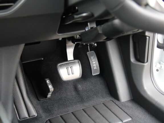 Footwell shown with pedal guard removed, but mounting point visible.