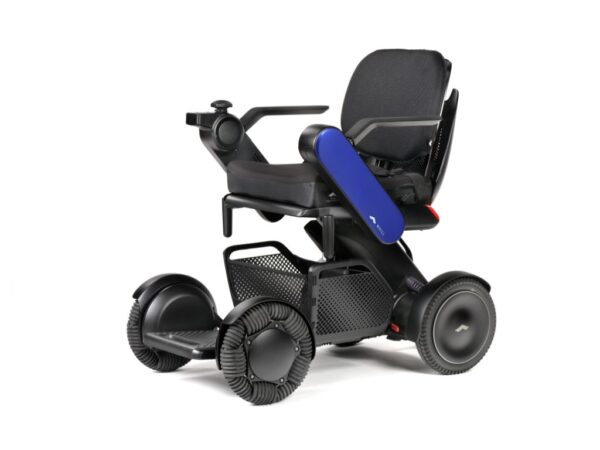 A TGA Whill Model C2 electric powerchair with an under-seat basket and omni-directional front wheels.