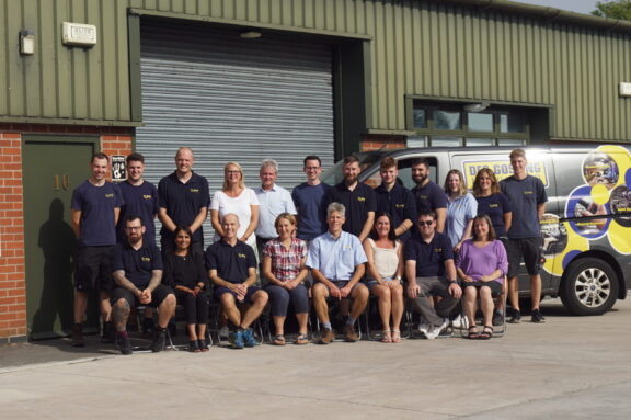 Staff Photo outside DGM Workshop
