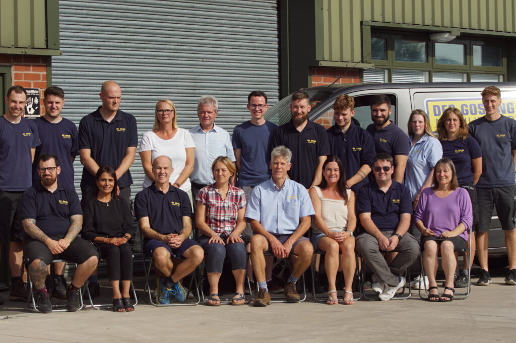 Staff Photo outside DGM Workshop