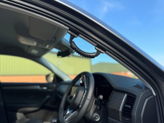 The grab handle is shown attached to the A-Pillar on the driver's side.