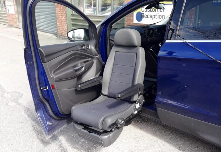 Turney Evo swivel seat is shown extended and lowered out of the front passenger side door.