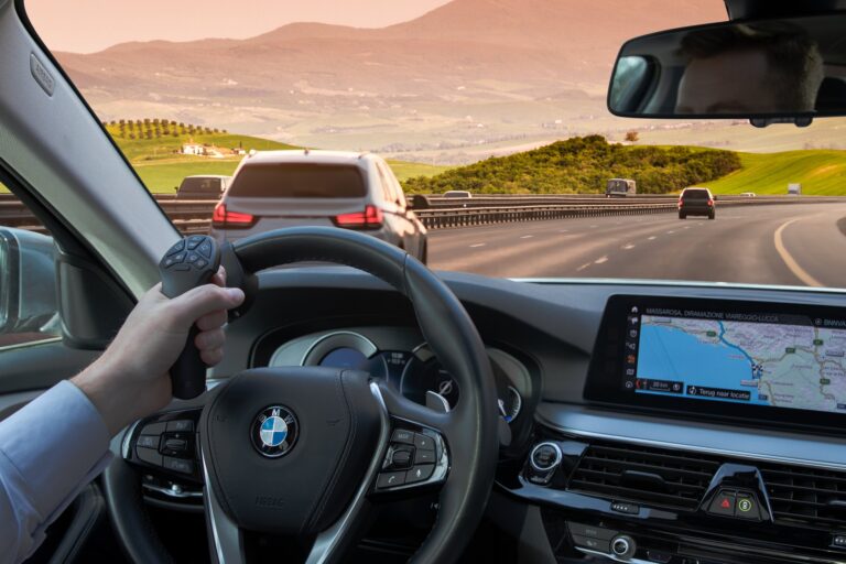SmartSteer controller being used to steer a BMW along a motorway.