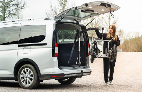 An open van boot lifts a mobility frame using a carolift 40 hoist.