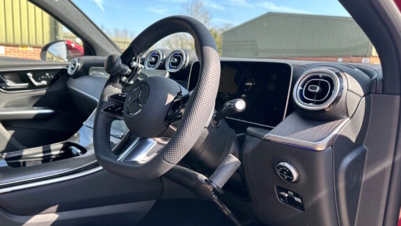 Push Pull hand controls installed in Mercedes CLA, shown through driver side door.