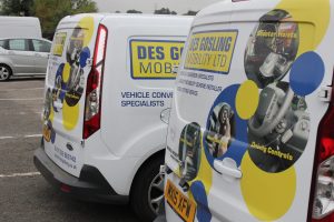 Two DGM vans