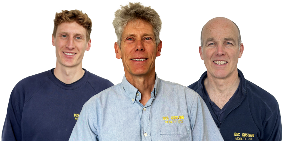 Photo of company founder Des with 2 more employees, each wearing different company apparel.